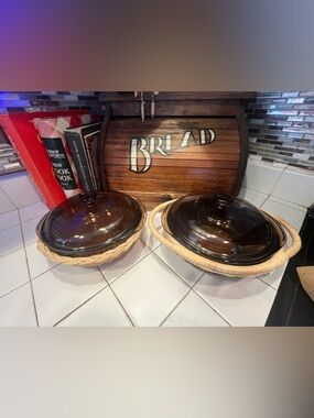 Pyrex Brown Amber Glass Lidded Casserole Dishes with Wicker carrying Trays